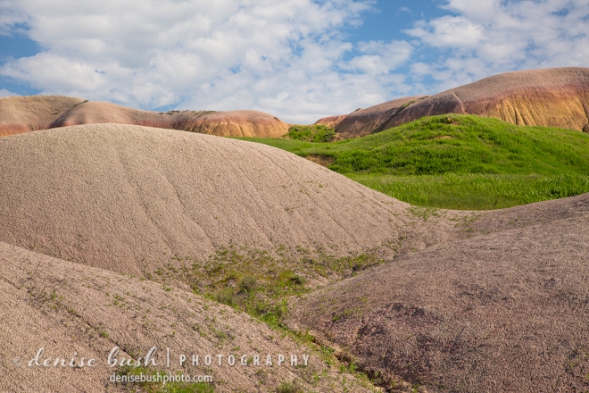 Formations in The Badlands National Park can be smooth and display a variety of colors as seen in this view including some of the ‘Yellow Mounds’.