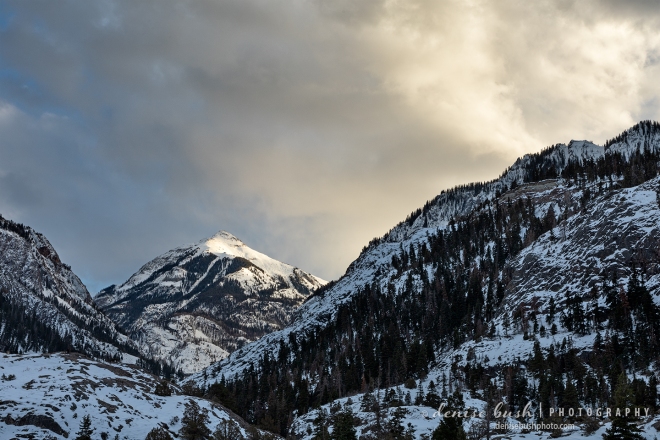Storm clouds roll in to the mountains outside of Ouray Colorado, only to give way to illuminate Mount Abram.